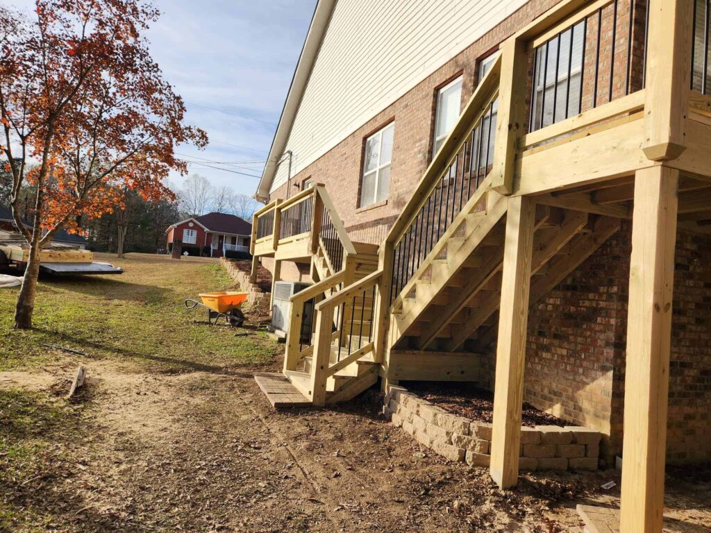 Custom deck and stairs at a family home by Elite Decks, deck builder serving Gardendale, AL