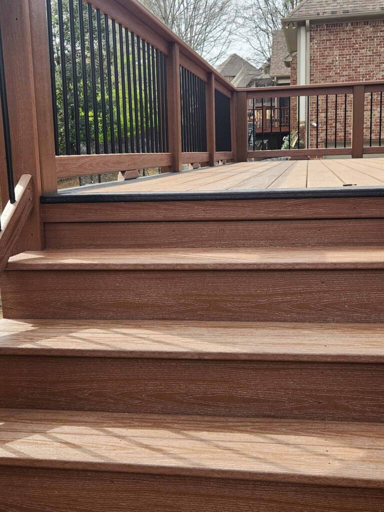 Custom deck stairs and railing by Elite Decks, deck builder serving Hayden, AL