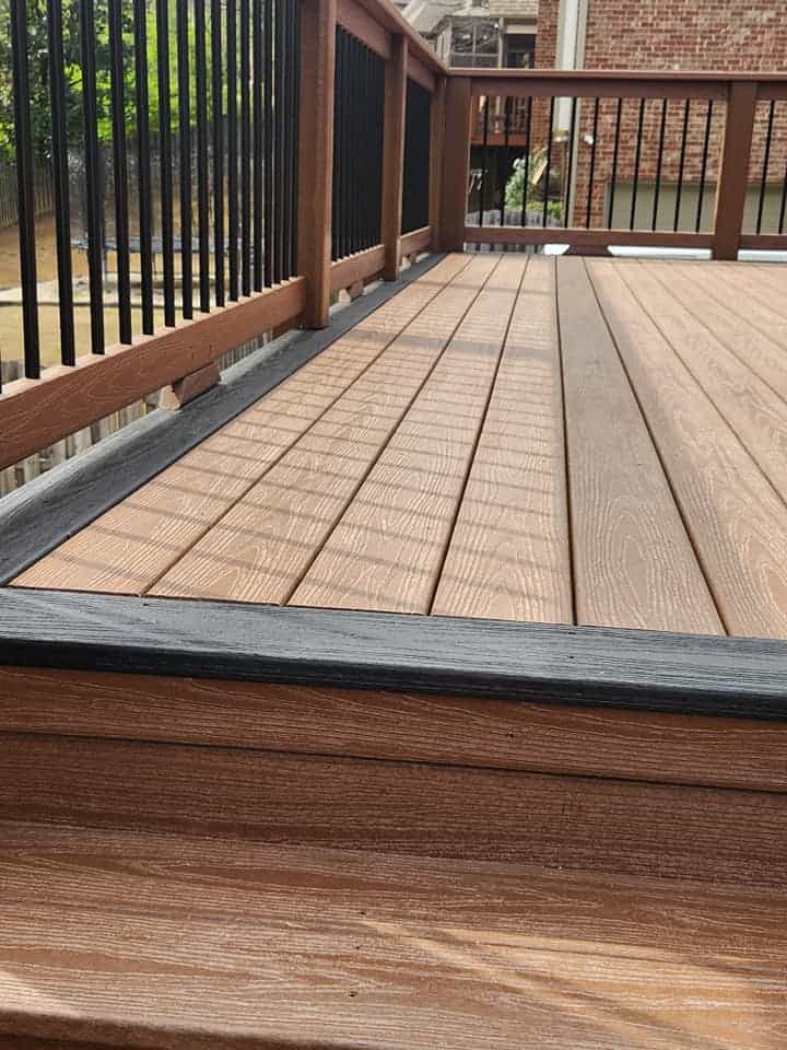Composite deck surface with black railings by Elite Decks, deck builder serving Morris, AL