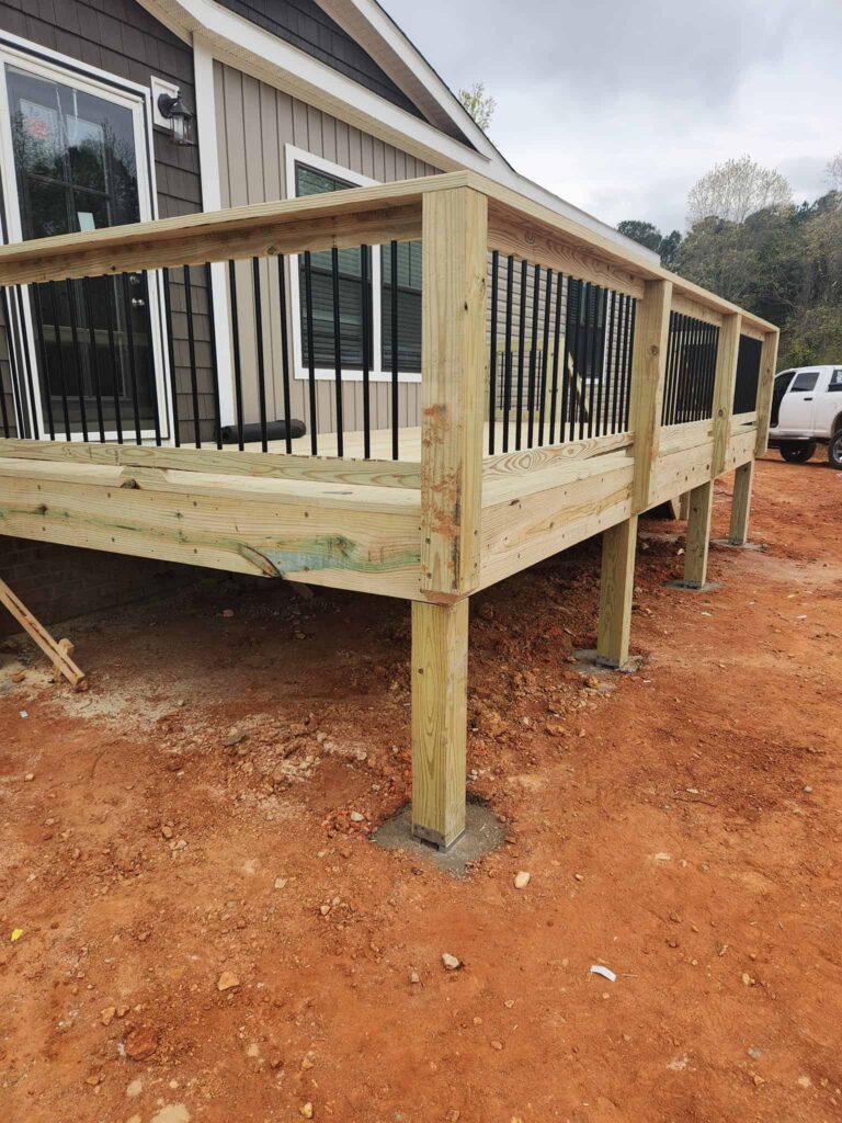Raised deck with black railings during construction by Elite Decks, deck builder serving Trafford, AL